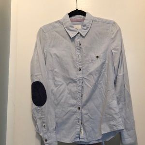 blue collared shirt with navy elbow patch detail